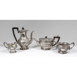 A late Victorian silver four piece tea and coffee service with floral and leaf cast mounts, the