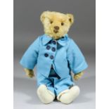 An early 20th Century Steiff blond mohair bear with button eyes, 13ins high, dressed in "The English