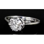 A modern platinum mounted diamond solitaire ring, the brilliant cut stone approximately .90ct (gross