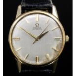 A modern gentleman's 9ct gold Omega automatic wristwatch, the silvered dial with baton numerals,
