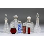 Seven cut-glass and coloured glass scent bottles and one Chinese porcelain scent bottle, all with