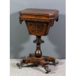 An early Victorian rosewood rectangular work table with angled corners, the lifting top revealing