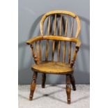 A 19th Century child's ash and elm seated stick back Windsor armchair by F. Walker of Rockley,