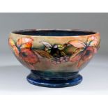 A large and unusual Moorcroft pottery pedestal bowl, tube lined and decorated in colours with "
