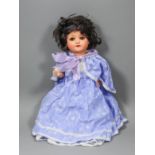 An early 20th Century Ernst Heubach Koppelsdorf 320 bisque headed girl doll with closing brown eyes,
