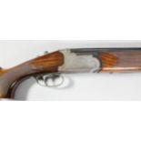 A 12 bore over and under multi choke single selective trigger shotgun by Lamber, Serial No.