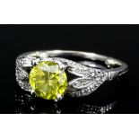 A modern 18ct white gold mounted yellow diamond solitaire ring, the brilliant cut stone