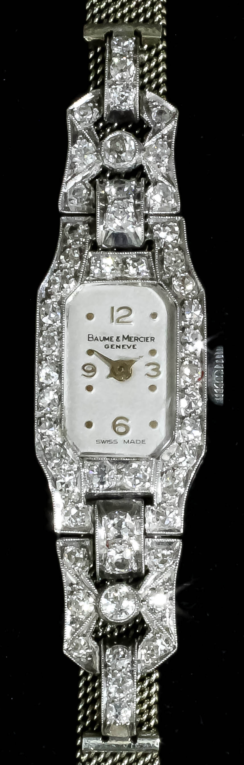 A 1930s lady's 18ct white gold diamond set Baume & Mercier cocktail watch, the silvered dial with