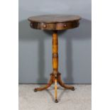 A 19th Century Maltese olivewood circular drum table with segmented veneered top, fitted four