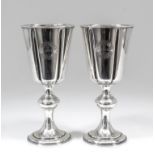 A pair of early Victorian silver chalices, the trumpet shaped bowls with moulded rims and reeded