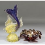 A Venetian glass fish, 11.75ins high, and a ditto circular bowl with shaped and roll-over rim,
