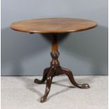 A George III mahogany circular tripod table with plain one piece top, on turned central column and