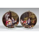 A pair of 19th Century Continental enamel plaques, one with three children seated in a stable, one