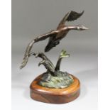 Carl Wagner (20th Century) - Brown patinated bronze - "The Loner" - Goose in flight, 10.75ins