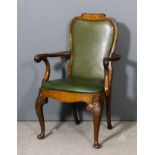 A walnut armchair of "Queen Anne" design, the shaped back with scroll pattern cresting, shaped