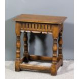 An oak rectangular joint stool of "17th Century" design with moulded edge to top, arcaded frieze, on