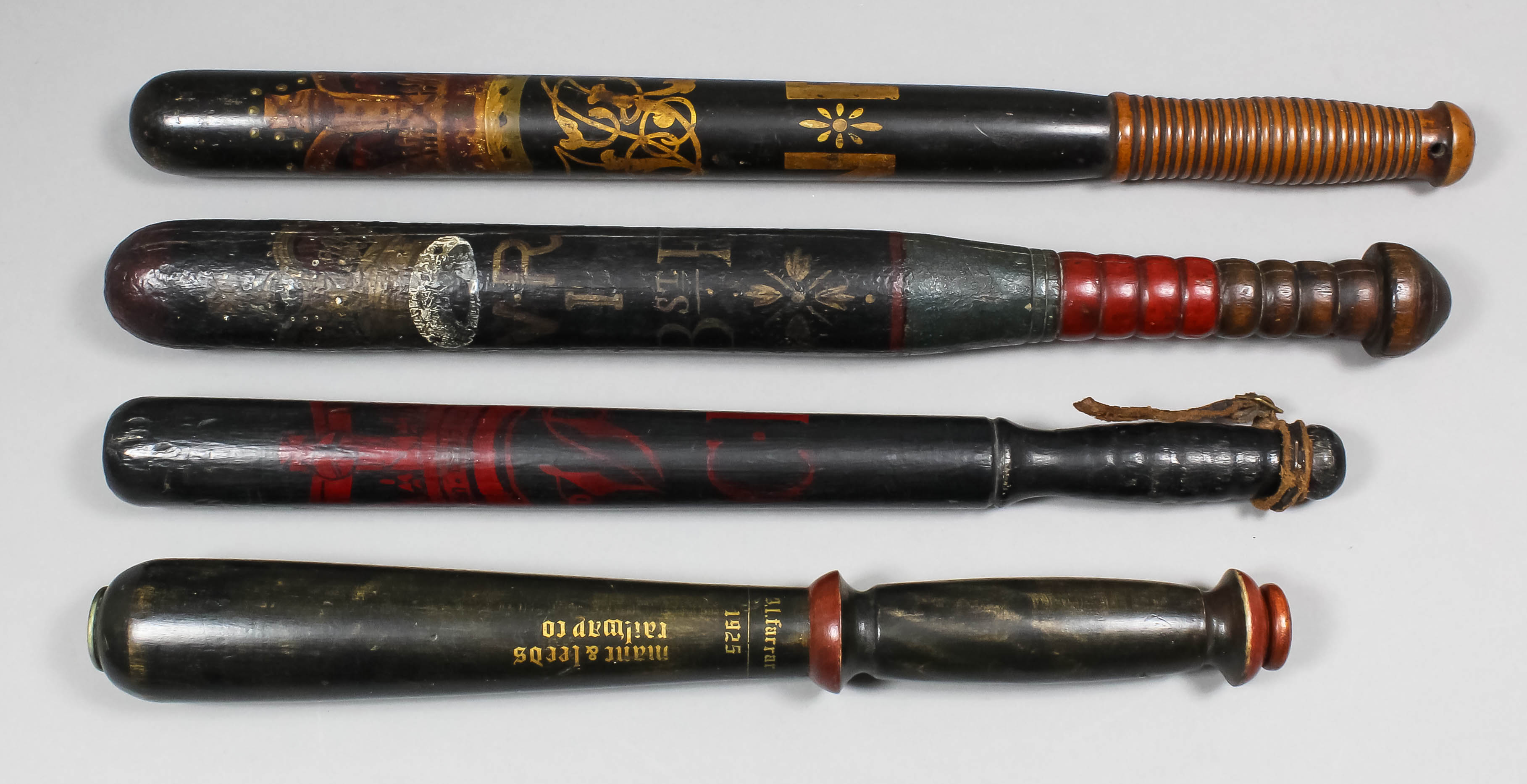 A Victorian turned wood truncheon painted with a crown over the royal cipher above "I.Bst.E.RY." (
