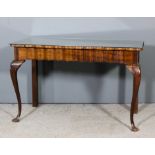 A 20th Century South African stinkwood rectangular occasional table of shaped outline with shaped