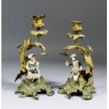 A good pair of 19th Century ormolu and Minton porcelain mounted candlesticks of rococo form,  10.