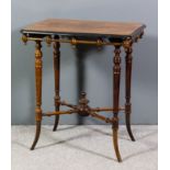 A late Victorian walnut and ebonised rectangular occasional table on four slender turned supports