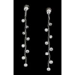 A pair of modern Dior 18ct white gold and diamond pendant drop earrings (screw fittings), the fine