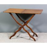 A 19th Century mahogany folding coaching table, the plain top with rounded corners, on turned