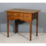 A George III oak lowboy with moulded edge to top, fitted three small drawers above shaped apron,
