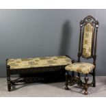 An oak high back hall chair of Carolean design with scroll carved cresting, on stop fluted uprights,