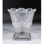 A mid 19th Century cut-glass vase on square foot, 9ins high