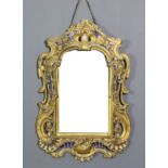 A 19th Century Italian gilt rectangular wall mirror of rococo form, the frame shaped and pierced