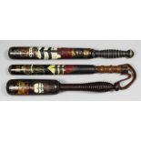 A George IV turned wood truncheon painted with the royal cipher over a crown supported by the arms