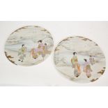 A PAIR OF 20TH CENTURY JAPANESE CIRCULAR PLAQUES lake side scenes with women and children standing