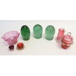 THREE VICTORIAN GREEN GLASS DUMPS, all with clear bubble inclusions, 5 1/2" (14cm) high and slightly