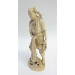 JAPANESE MEIJI PERIOD CARVED ONE PIECE IVORY OKIMONO OF A FISHERMAN, modelled standing holding a