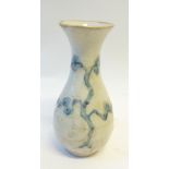 AN AGED PROBABLY KOREAN PORCELAIN BALUSTER SHAPE VASE with trumpet neck, 'finger' painted in thick