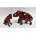 TWO ROYAL DOULTON FLAMBÉ POTTERY MODELS OF ANIMALS comprising: elephant with trunk raised, 6 3/4" (