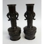PAIR OF JAPANESE DARK BROWN PATINATED BRONZE VASES of tapering form with mask handles to the tall