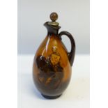 ROYAL DOULTON/GREENLEES BROTHERS WHISKY CRUSADER KINGSWARE POTTERY FLASK of footed baluster form