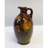 ROYAL DOULTON ALCHEMIST KINGSWARE POTTERY FLASK of footed oviform with loop handle, 8 1/2" (21.