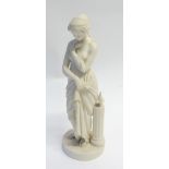 20th CENTURY PARIAN SEMI-NAKED FEMALE FIGURE, modelled standing beside a pedestal and oil lamp, on a
