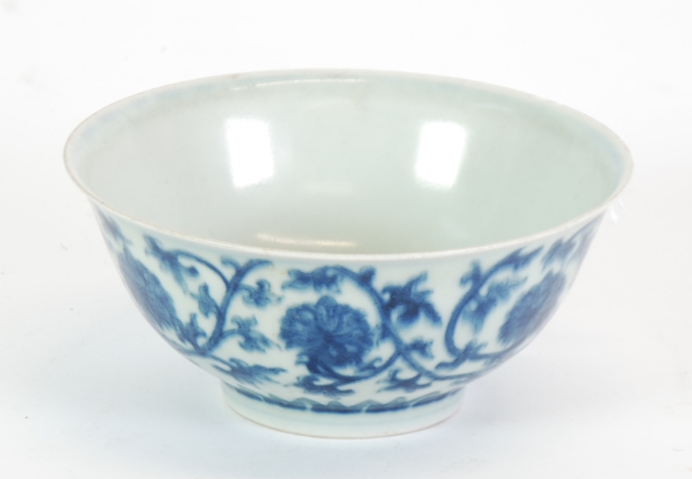 A SMALL CHINESE PORCELAIN BOWL bearing a six character Xuande (1426 - 35) reign mark within a double