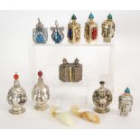 SIX MODERN CHINESE EMBOSSED WHITE METAL SNUFF BOTTLES, including two 'Four faces' examples,