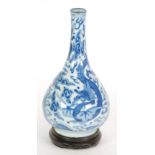 LATE 19th/EARLY 20th CENTURY CHINESE BLUE AND WHITE VASE of footed baluster form with tall