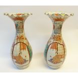 A PAIR OF JAPANESE MEIJI PERIOD PORCELAIN VASES, of footed baluster form with flared, wavy rims,