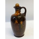 ROYAL DOULTON GILLY AND FISHERMAN KINGSWARE POTTERY FLASK of footed oviform with loop handle and