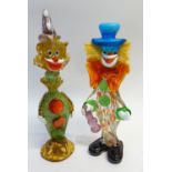 TWO COLOURED GLASS FIGURES OF CLOWNS, one a decanter, 17" and 15 1/2" (43.2 and 39.4cm) high (2)