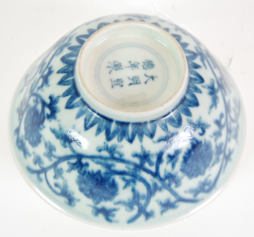 A SMALL CHINESE PORCELAIN BOWL bearing a six character Xuande (1426 - 35) reign mark within a double - Image 3 of 3