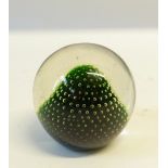 HOLMEGAARD, DANISH GLASS PAPERWEIGHT with clear glass on a green domed ground, 3" (7.6cm) high,