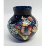 WALTER MOORCROFT 'ORCHID' PATTERN TUBE LINE POTTERY VASE, oviform with short cylindrical neck,