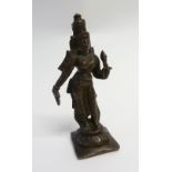 FAR EATERN PATINATED BRONZE FIGURE OF A FEMALE DEITY on a square base, 5 3/4" (14.6cm) high